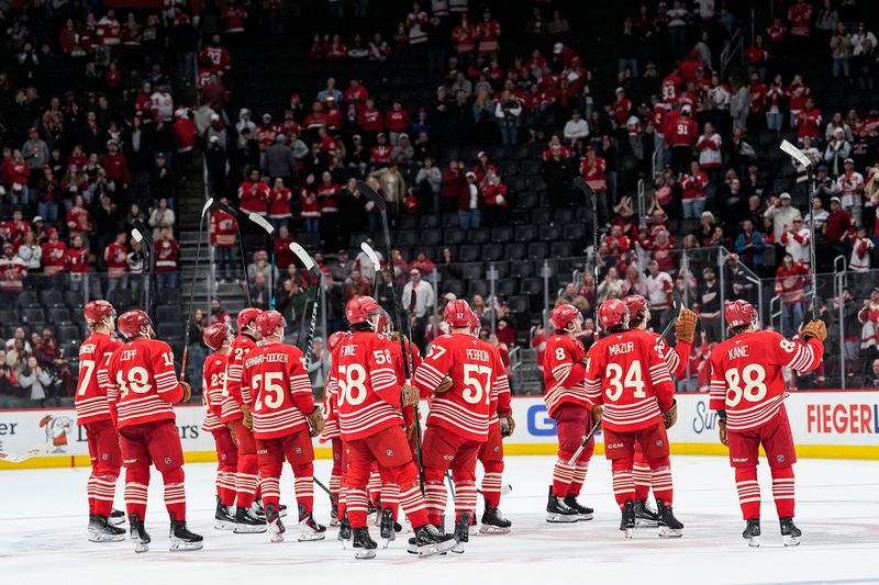Detroit Red Wings players acknowledge broadcaster Paul Woods after 5-3 loss to New Jersey Devils at Little Caesars Arena in Detroit on Saturday, April 11, 2026.