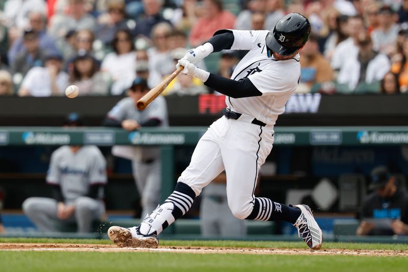 Apr 12, 2026; Detroit, Michigan, USA; Detroit Tigers shortstop Kevin McGonigle (7) hits a single in the third inning against the Miami Marlins at Comerica Park. Mandatory Credit: Rick Osentoski-Imagn Images