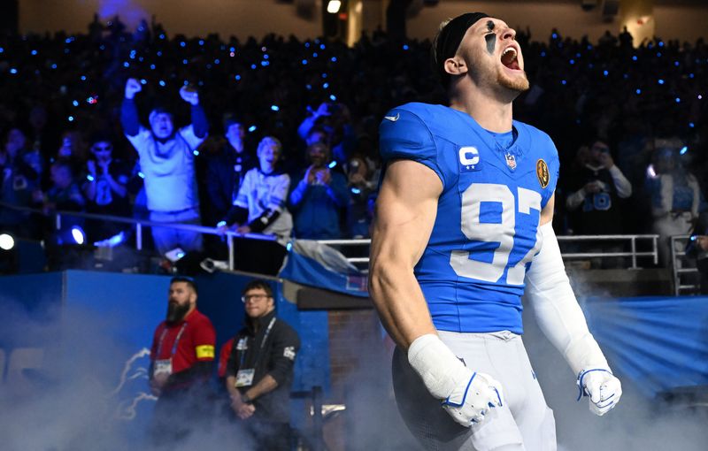 Nov 27, 2025; Detroit, Michigan, USA; Detroit Lions defensive end Aidan Hutchinson (97) runs onto the field prior to the game against the Green Bay Packers at Ford Field. Mandatory Credit: Lon Horwedel-Imagn Images