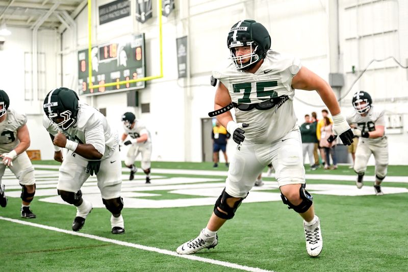 Michigan State's Ben Murawski and the rest of the offensive line participate in a drill during spring football practice on Tuesday, April 14, 2026, in East Lansing.