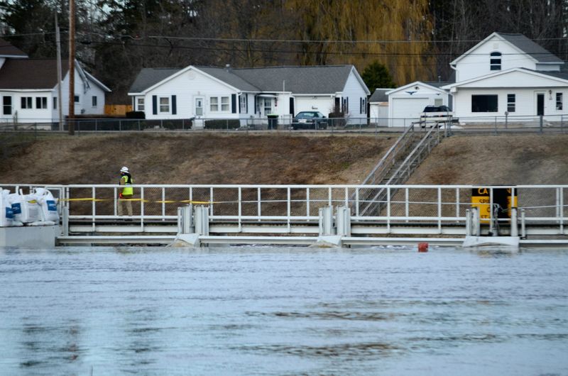 A worker walks across the Cheboygan Lock and Dam Complex on April 14, 2026.