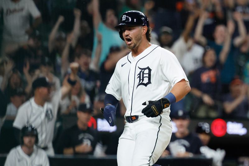 Detroit Tigers third baseman Zach McKinstry (39) celebrates after scoring in the eighth inning against the Kansas City Royals at Comerica Park in Detroit on Tuesday, April 14, 2026.