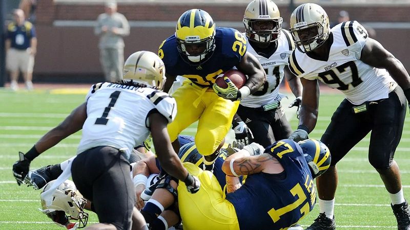On Sept. 3, 2011, Michigan running back Fitzgerald Toussaint (No. 28) was a standout in a season-opening victory against Western Michigan. But when that game ended, a tradition began involving the collection of cooked, unsold food from concession stands that is mostly delivered to trusted Detroit nonprofits that feed people in need. The tradition will continue Saturday at Michigan’s annual Maize versus Blue Spring Football Game at Michigan Stadium.
