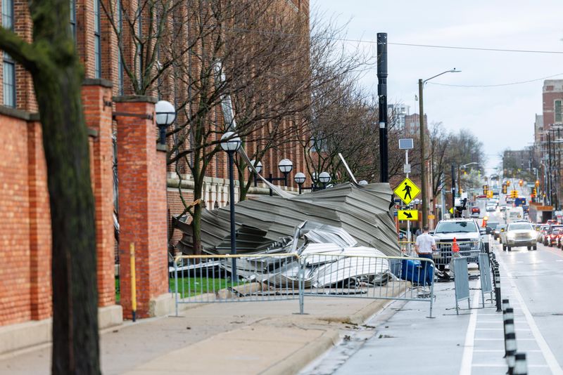 Roofing material lies on the ground after being blown off the roof of Yost Ice Arena early Wednesday, April 15, 2026, after a major storm ripped through the University of Michigan campus in Ann Arbor.