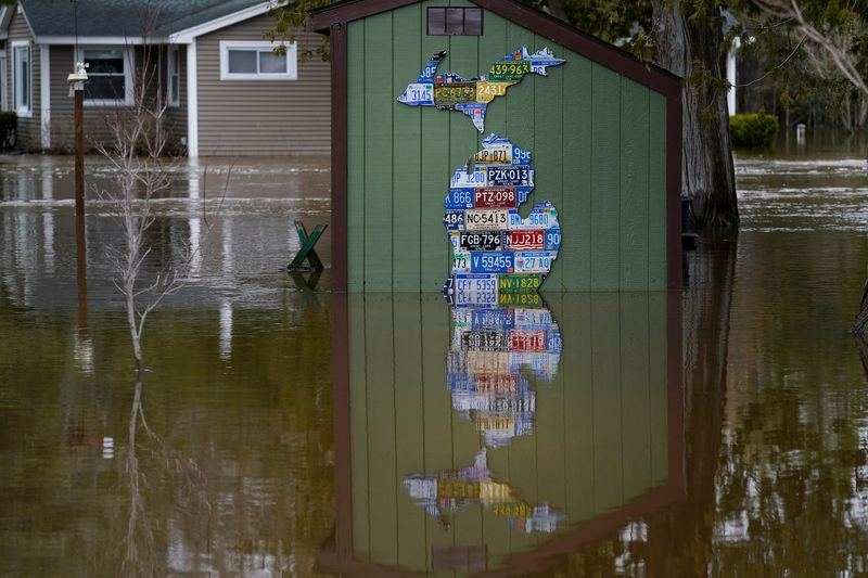 A shed is submerged in the Sturgeon River in the town of Indian River as flooding plagues the area on Wednesday, April 15, 2026.