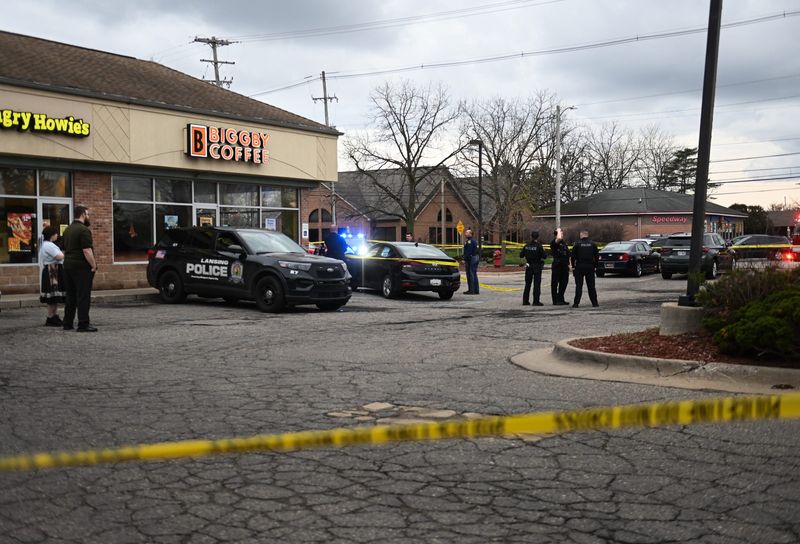 First responders work near the intersection of West Lake Lansing and Abbot Roads in East Lansing, Wednesday, April 15, 2025. Officials say police responded to a report of a theft at a business around 6:06 p.m. Shortly thereafter, a 911 call reported a stabbing victim, and police ultimately shot the suspect