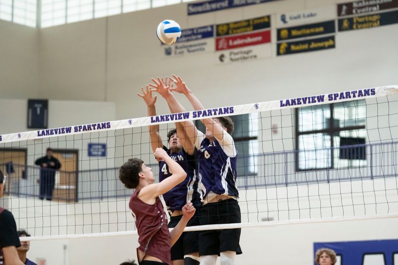 Lakeview juniors Carter Jenkins and Sean O'Donnell block during a game against Kalamazoo Central at Lakeview High School on Wednesday, April 16, 2026.