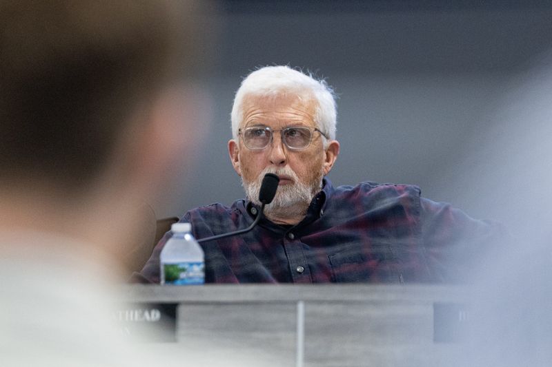 Chair Mark Leathead listens as representatives from Key Capture Energy speak during a meeting of the Blendon Township Planning Commission.