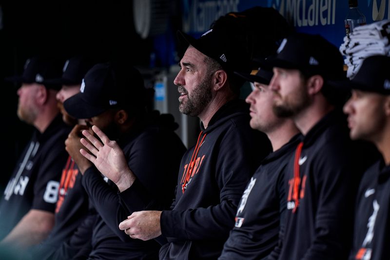 Detroit Tigers pitcher Justin Verlander, center, looks on from the dugout during the eighth inning against Kansas City Royals at Comerica Park in Detroit on Thursday, April 16, 2026.