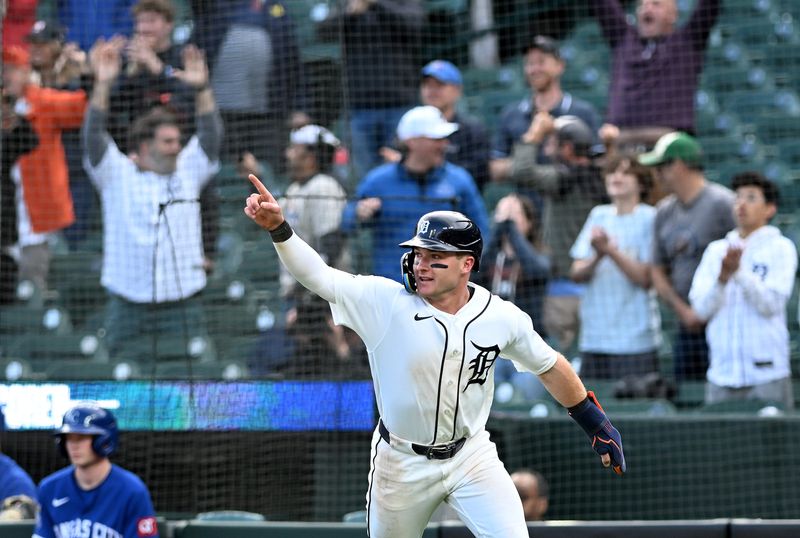 Tigers’ Kevin McGonigle points out towards Riley Greene after Greene’s double scores McGonigle and Gleyber Torres, not shown, tie the game in the ninth inning.