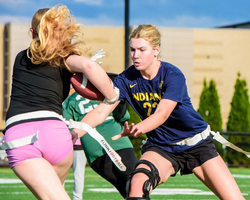 BIrmingham Groves' Ella Kecskemeti pulls a flag during a Michigan Girls High School Flag Football practice on Thursday, April 16, 2026.