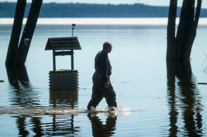 Residents navigate floodwater from Black Lake reaching homes along N. Black River Road in Cheboygan on Friday, April 17, 2026. As of Friday morning, the water level at Cheboygan Dam had decreased slightly from the day before.