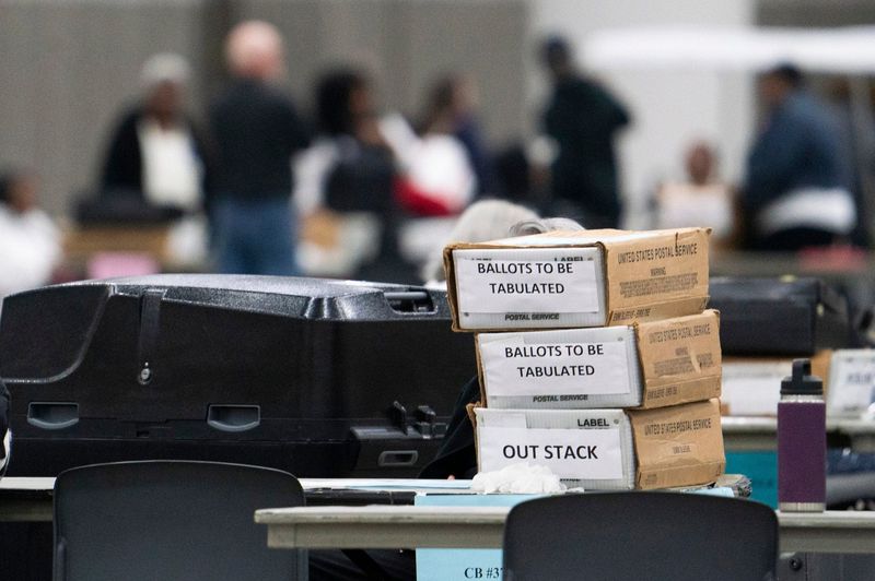 Election workers continue to count absentee and early voting ballots at Huntington Place on Monday Nov. 4, 2024 in Detroit.