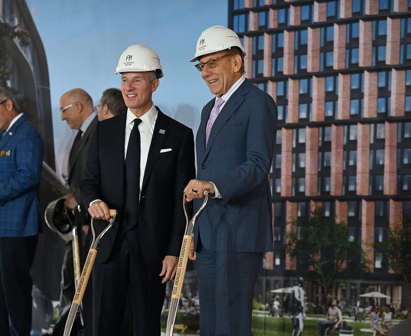 Chris IIitch, CEO of IIitch Holdings, from left, and Stephen M. Ross, Chairperson of Related Companies, pose for a photo after the press conference for the groundbreaking for the new Founders House, UMCI Residential Building on Friday, April 17, 2026, in Detroit, Mich.