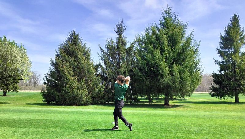 Ben Scully tees off for Flat Rock during the Huron League jamboree at Green Meadows Golf Course on Friday, April 17, 2026.