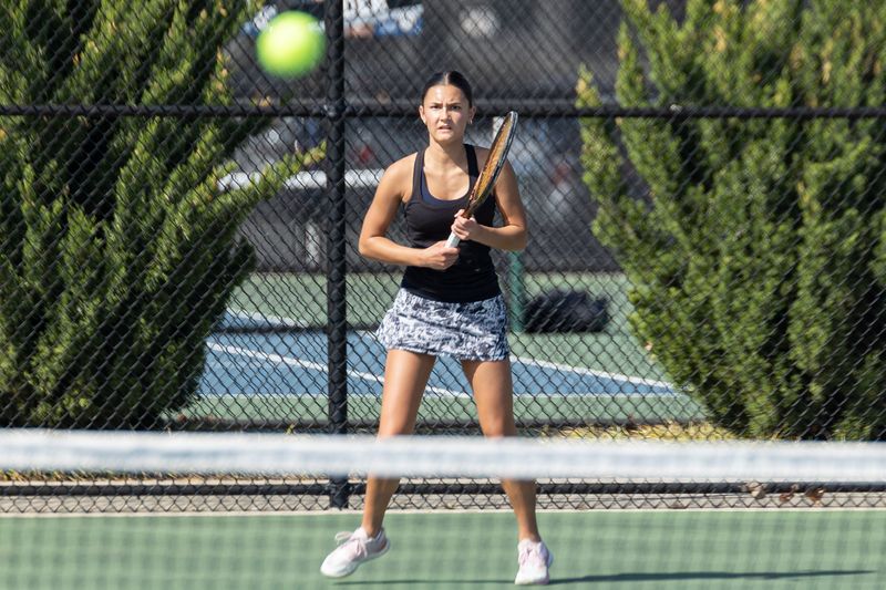 West Ottawa's Evie Price prepares to return a shot against Rockford on Friday, April 17, 2026, at West Ottawa.