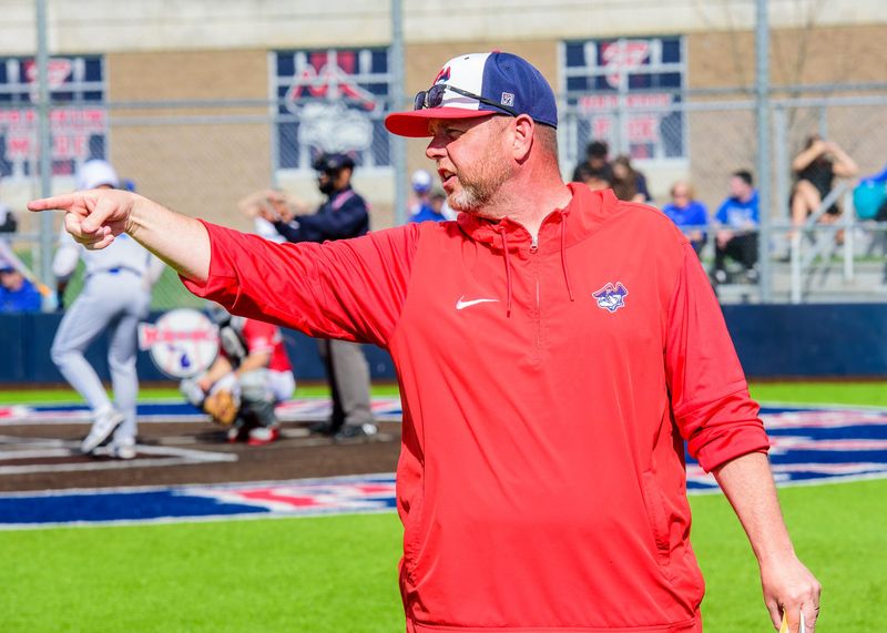 Livonia Franklin coach Matt Fournier organizes his defense during a nonconference baseball game on Friday, April 17, 2026.