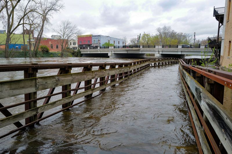 The boardwalk along the Lansing River Trail in Old Town is submerged Saturday, April 18, 2028.