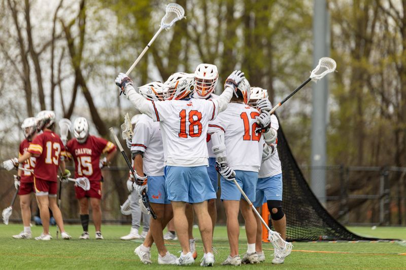 The Hope lacrosse team celebrates a goal against Calvin on April 18. Hope advanced to the elite eight of the NCAA Division III tournament.