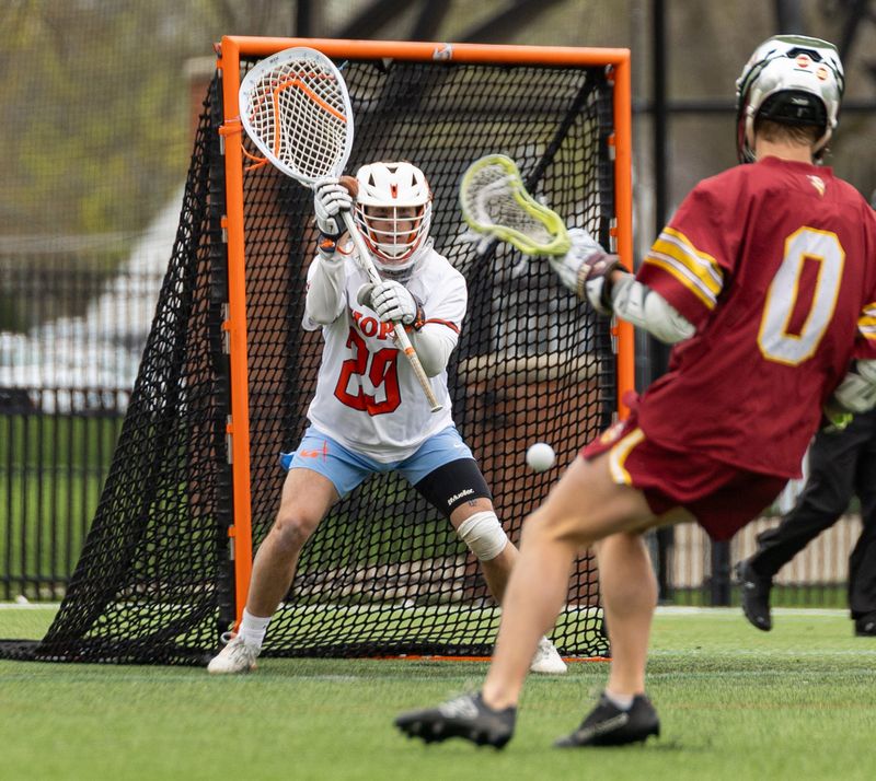 Hope's Jack Balmforth prepares to stop the incoming shot on goal against Calvin on Saturday, April 18.
