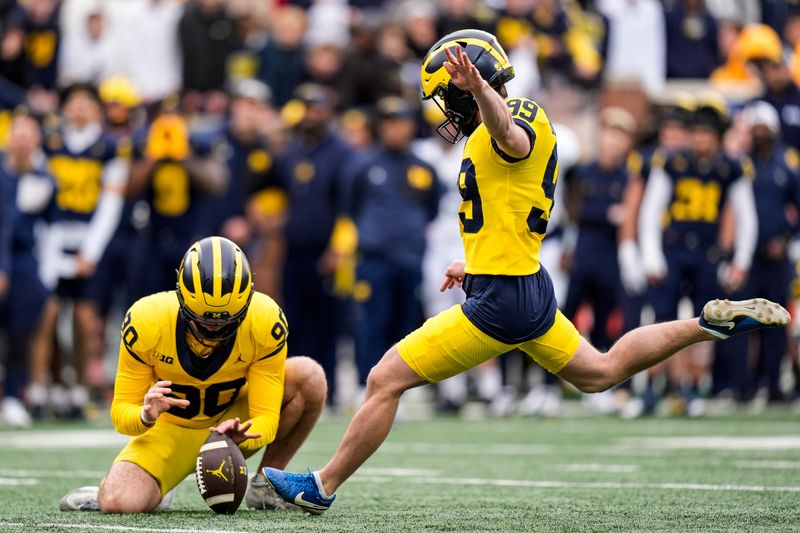 Michigan kicker Trey Butkowski (99) attempts an extra point during the spring game at Michigan Stadium in Ann Arbor on Saturday, April 18, 2026.