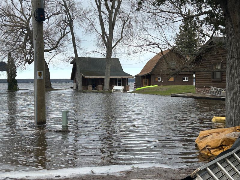 Cottages are surrounded by flood water on Pigeon River Bay in Cheboygan County on April 19, 2026.