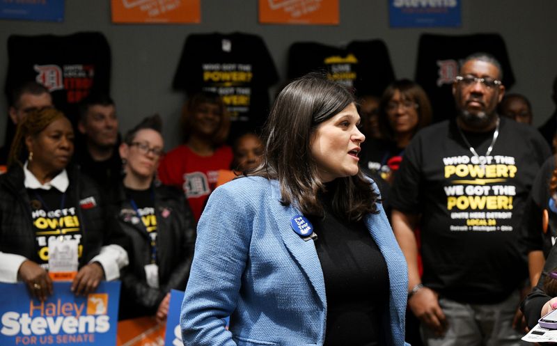 Surrounded by supporters U.S. Rep. Haley Stevens answers questions from reporters during the Michigan Democratic Party nominating convention at Huntington Place on April 19, 2026 in Detroit.