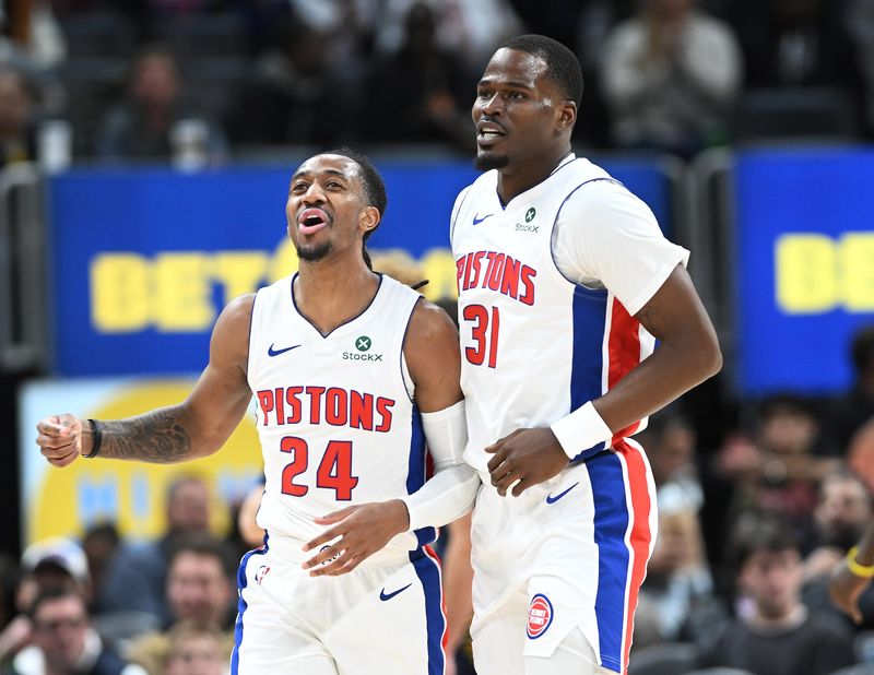 Detroit Pistons guard Daniss Jenkins (24) and Detroit Pistons guard Javonte Green (31) celebrate in the second quarter. Detroit Pistons vs Indiana Pacers at Little Caesars Arena on November 17, 2025, in Detroit, MI.