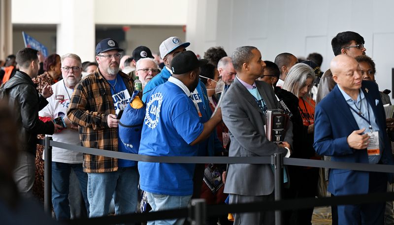 People stand in line to vote during the Michigan Democratic Party nominating convention at Huntington Place on April 19, 2026 in Detroit. Not everyone had to vote this way but some people did not receive the link or email, so this line is for them to still be able to vote.