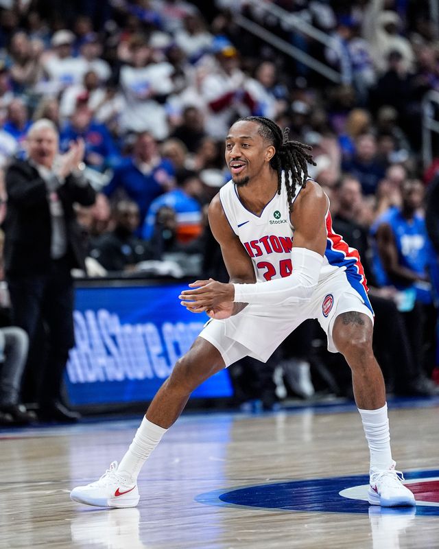Detroit Pistons guard Daniss Jenkins celebrates a play against the Orlando Magic during the first half of Game 1 of the first round of the NBA playoffs at Little Caesars Arena in Detroit on Sunday, April 19, 2026.