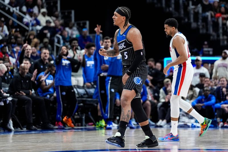 Orlando Magic forward Paolo Banchero (5) celebrates a 3-pointer against Detroit Pistons during the first half of Game 1 of the first round of the NBA playoffs at Little Caesars Arena in Detroit on Sunday, April 19, 2026.