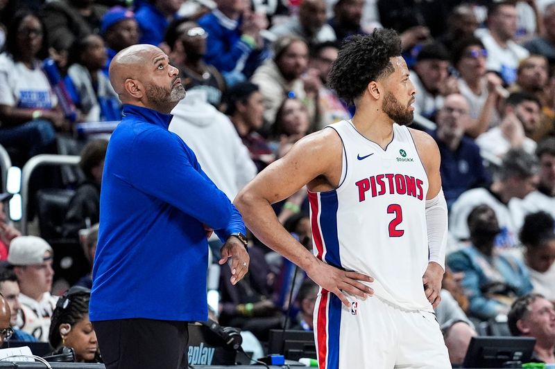 Detroit Pistons head coach J.B. Bickerstaff watches a replay next to guard Cade Cunningham during the second half of Game 1 of the first round of the NBA playoffs at Little Caesars Arena in Detroit on Sunday, April 19, 2026.
