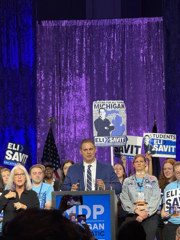 Washtenaw County Prosecutor Eli Savit speaks at the Michigan Democratic Party statewide endorsement convention on Sunday, April 19, 2026, at Huntington Place in Detroit.