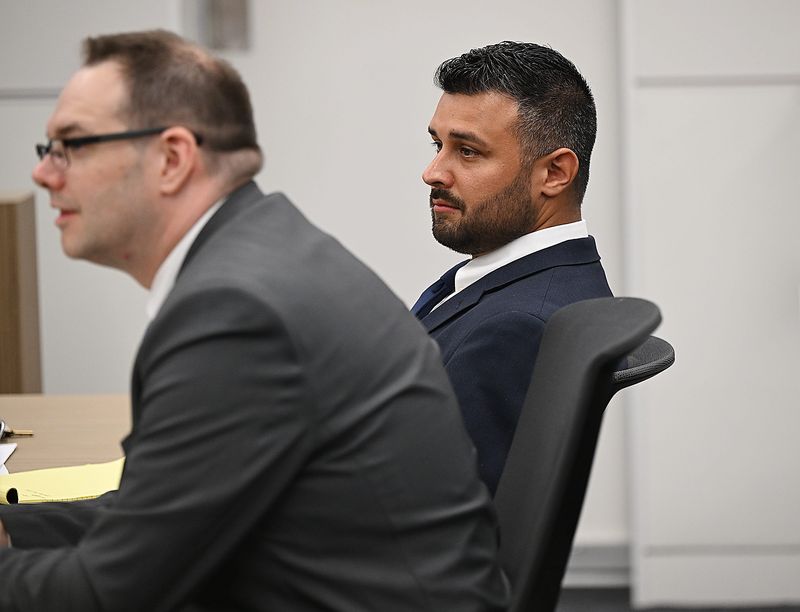 Matthew Furman, (r), a Melvindale police officer, is charged with using excessive force on Drakkar Williams during a traffic violation in 2024. Wayne County Criminal Justice Center on Monday, April 20, 2026, in Detroit, Mich.