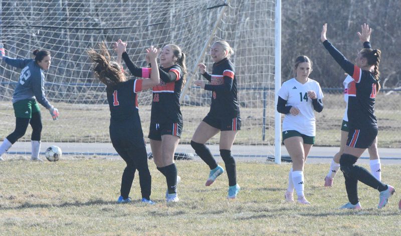 Cheboygan senior Carley Lopiccolo (1) celebrates with teammates Morgan Davis (12), Mallory Ekdahl (9) and Jaelyn Wheelock (11) after scoring her first-career varsity goal in a 1-0 victory over Grayling in a girls soccer matchup on Monday April 20.