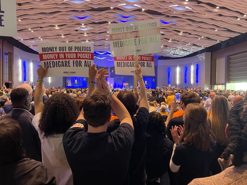 Supporters of U.S. Senate candidate Abdul El-Sayed show their support as Democrats pack the circular convention hall at Huntington Place in downtown Detroit on April 19, 2026, at their party's statewide candidate endorsement convention.