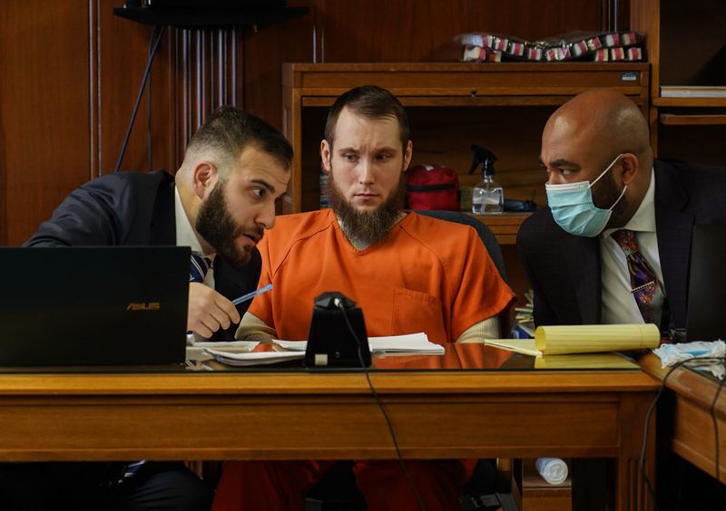 Joseph Morrison listens as his attorney Nicholas Somberg (left) and attorney Kareem Johnson (right) speak to each other as Morrison appears in front of Judge Thomas D. Wilson at the Jackson County Courthouse in Jackson on Monday, December 20, 2021 for his role in the plot to kidnap Michigan Governor Gretchen Whitmer.