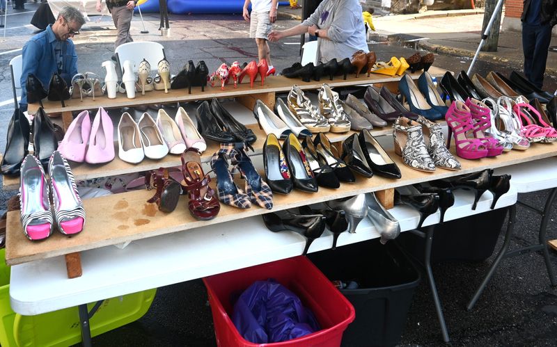 There is a rack of high heels up to size 16 for those who don't own their own for the Walk A Mile in Their Shoes.