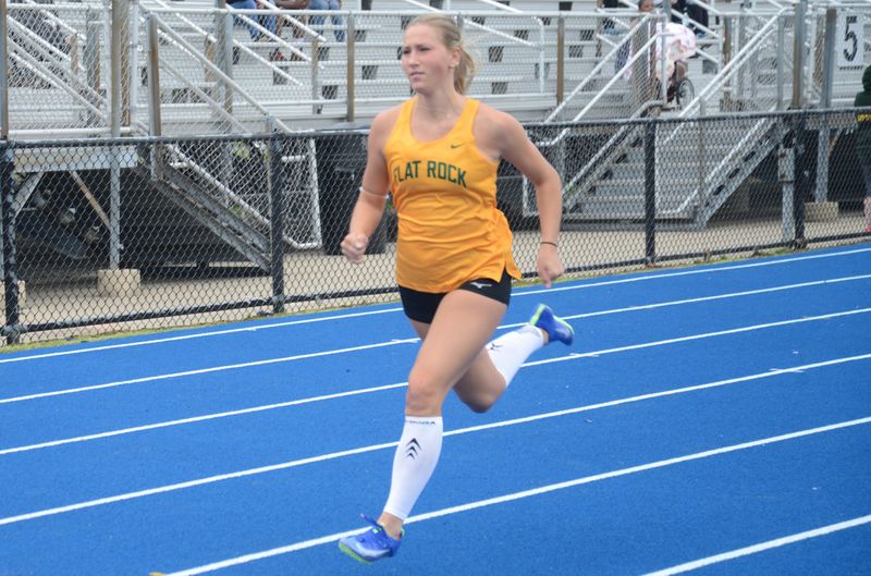 Reagan Higdon of Flat Rock wins the 100 meters during a 70-57 victory over Jefferson on Tuesday, April 21, 2026.