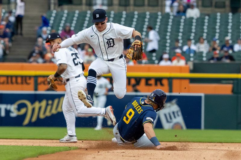 Detroit Tigers shortstop Kevin McGonigle fields a ground ball and forces out Milwaukee Brewers first baseman Jake Bauers to end the first inning at Comerica Park in Detroit on Tuesday, April 21, 2026.