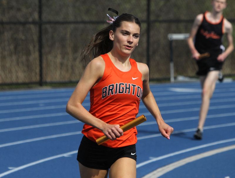 Brighton's Lydia LaMarra runs the 3,200-meter relay during a track and field meet against Hartland on Tuesday, April 21, 2026.