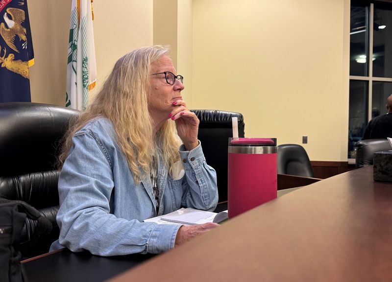 Trustee Sandy Groth talked with supporters after the April 21 meeting at Plymouth Township Hall.