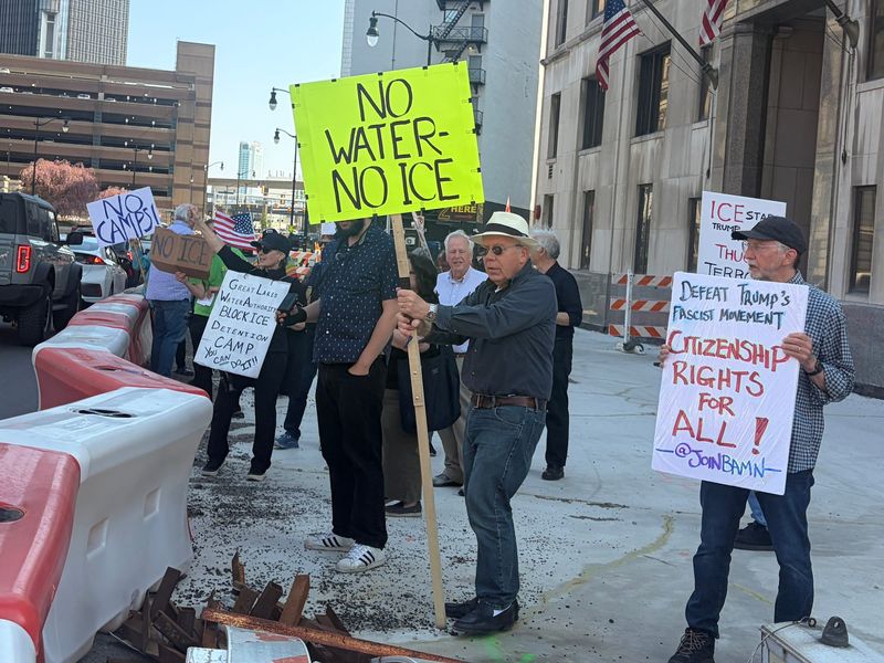 Protesters stand outside of the building where the Great Lakes Water Authority met at 735 Randolph Street in Detroit on Wednesday, April 22.