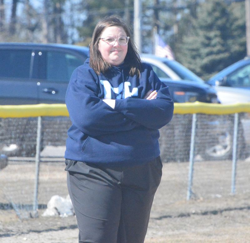 Mackinaw City softball coach Erica France looks on during game one of a doubleheader against Wolverine in Mackinaw City on Tuesday, April 21. France, a 2015 Cheboygan High School graduate, is in her first season leading the Comets.