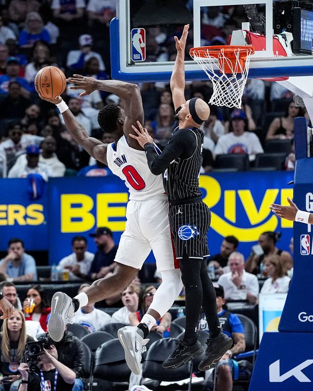 Detroit Pistons center Jalen Duren (0) goes to the basket against Orlando Magic guard Jalen Suggs (4) during the second half of Game 2 of the first round of the NBA playoffs at Little Caesars Arena in Detroit on Wednesday, April 22, 2026.