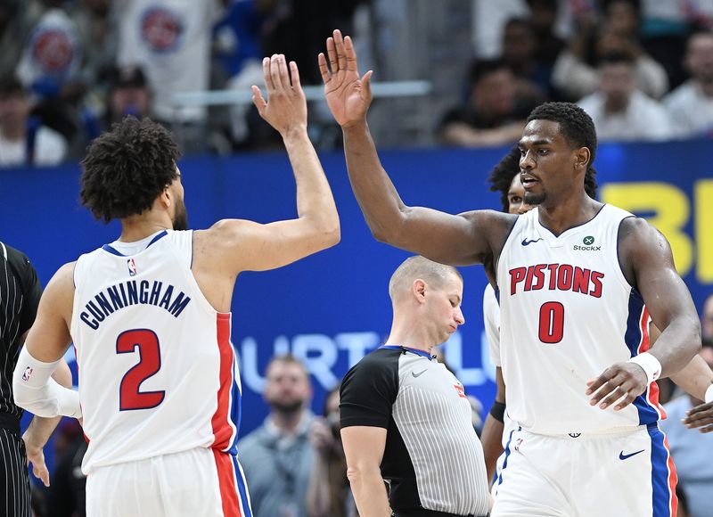 Detroit Pistons guard Cade Cunningham (2) and Detroit Pistons center Jalen Duren (0) celebrate in the second half. Detroit Pistons vs Orlando Magic, Round 1/Game 2 at Little Caesars Arena on Wednesday, April 22, 2026, in Detroit, Mich