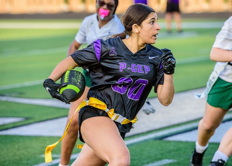 P-CEP's Jenna Mokachar rushes during a Michigan Girls High School Flag League scrimmage on Wednesday, April 22, 2026, at Birmingham Groves High School.