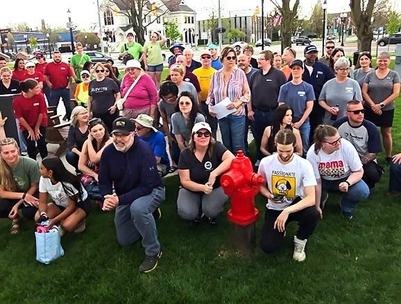 Volunteers for the annual city clean up gathered in Four Corners Park just before the rain and hail hit Coldwater April 22.