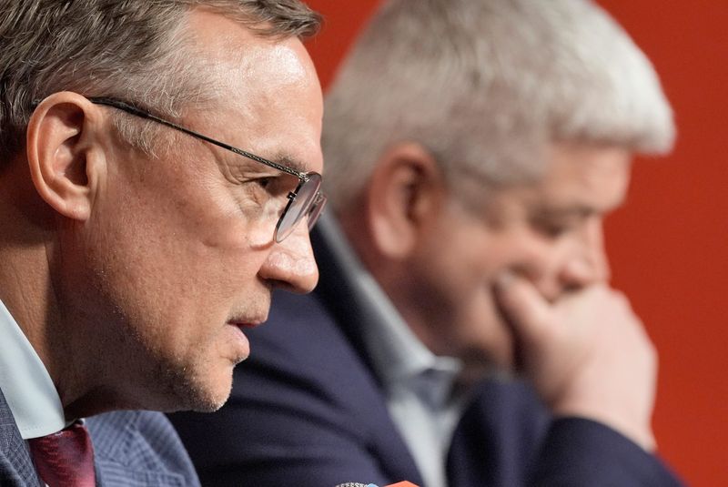 Detroit Red Wings general manager Steve Yzerman talks as coach Todd McLellan listens on Thursday, April 23, 2026 at Little Caesars Arena for their season-ending news conference after missing the NHL playoffs again.