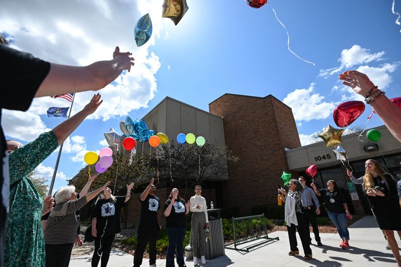 Friends and family of the late Kyron Kelemen release balloons, Thursday, April 23, 2026, following his stepmother Elysa Ella-Ann Kelemen's sentencing hearing at the Eaton County Courthouse in Charlotte. Kelemen was sentenced to life in prison without parole for killing her stepson, Kyron Kelemen, 6, in a Delta Township hotel in 2024.